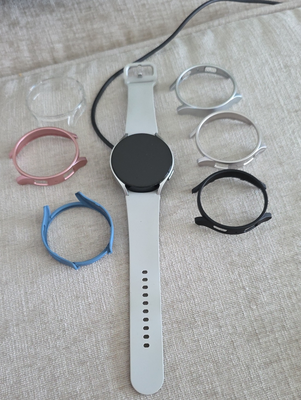 Silver Smartwatch with White Band and Interchangeable Bezels